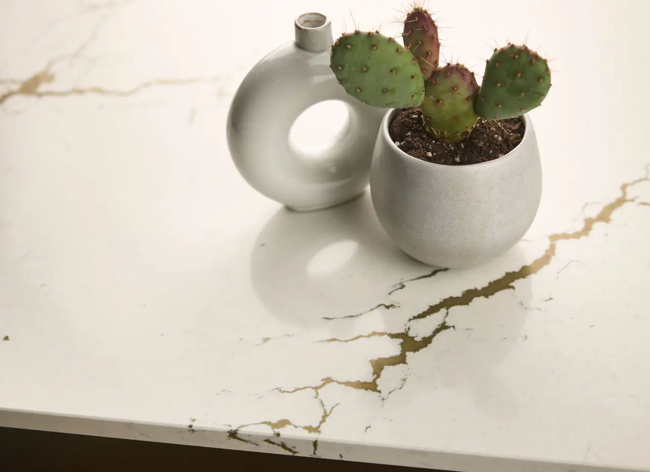 Berkshire Brass quartz countertop with gold veining and a visible countertop edge