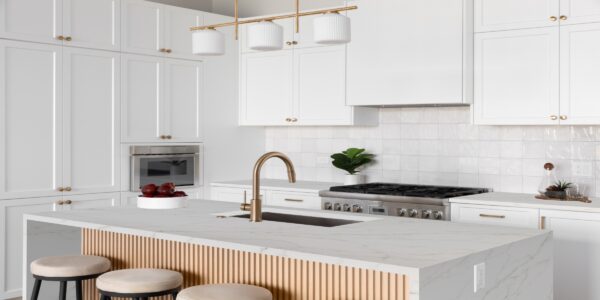 Calacatta Bolognia Quartz by Venezia Surfaces with white background and soft gray beige veining