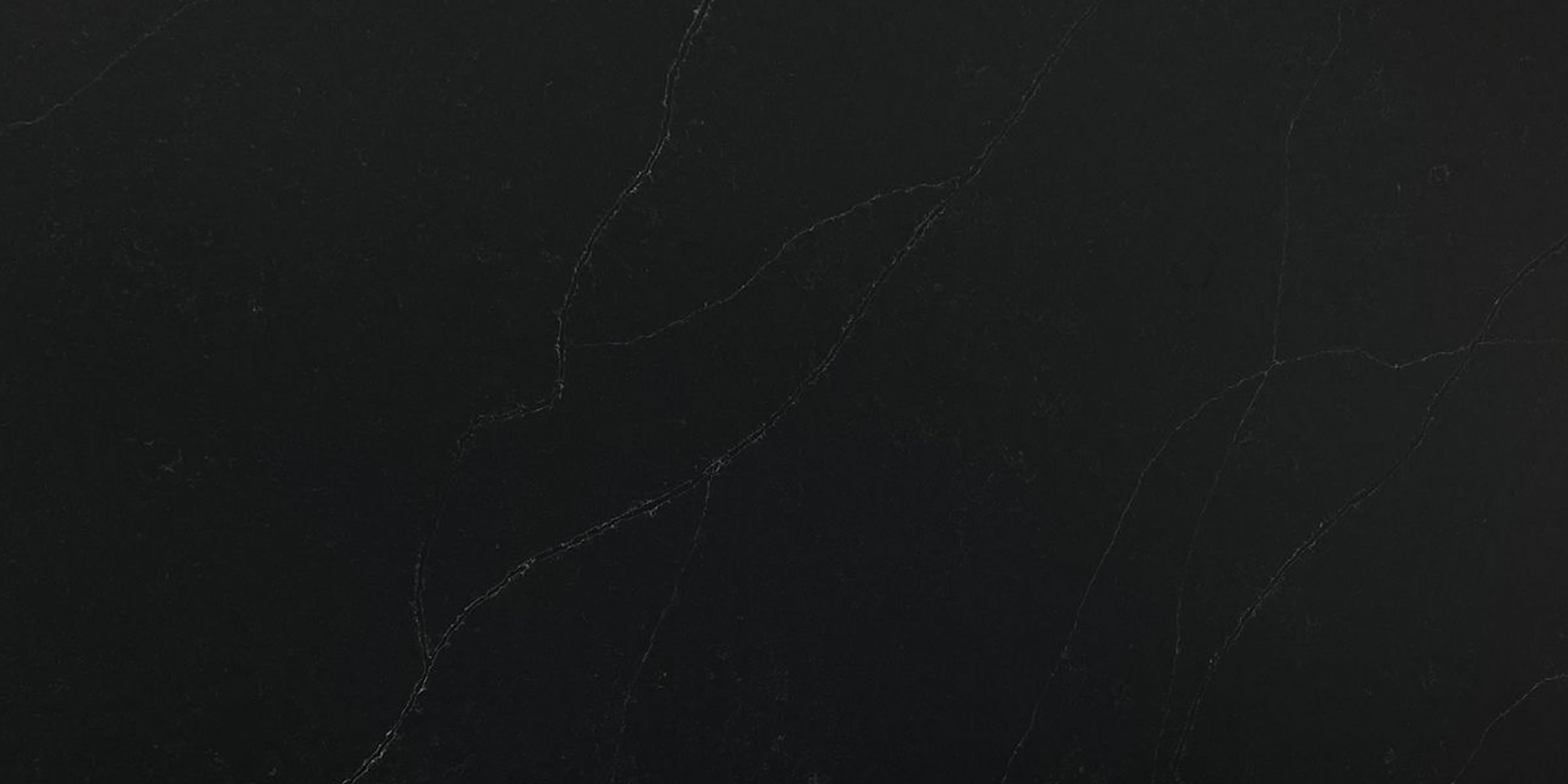 Brussels Blue Leather Jumbo Quartz by Venezia Surfaces dark black quartz slab with subtle blue undertones