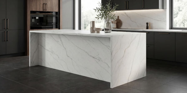 Calacatta Covelano Jumbo Quartz by Venezia Surfaces with white background and soft gray veining