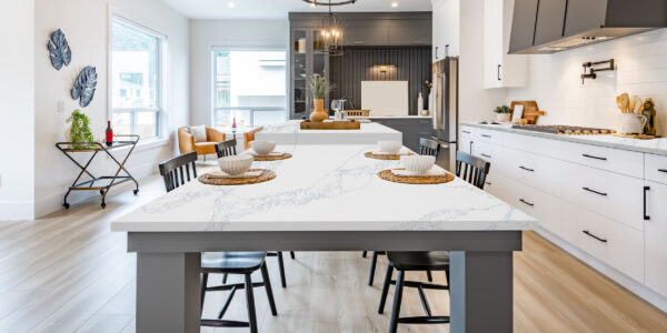 Calacatta Azure Black Fusion Jumbo Quartz by Venezia Surfaces with white background and blue gray veining