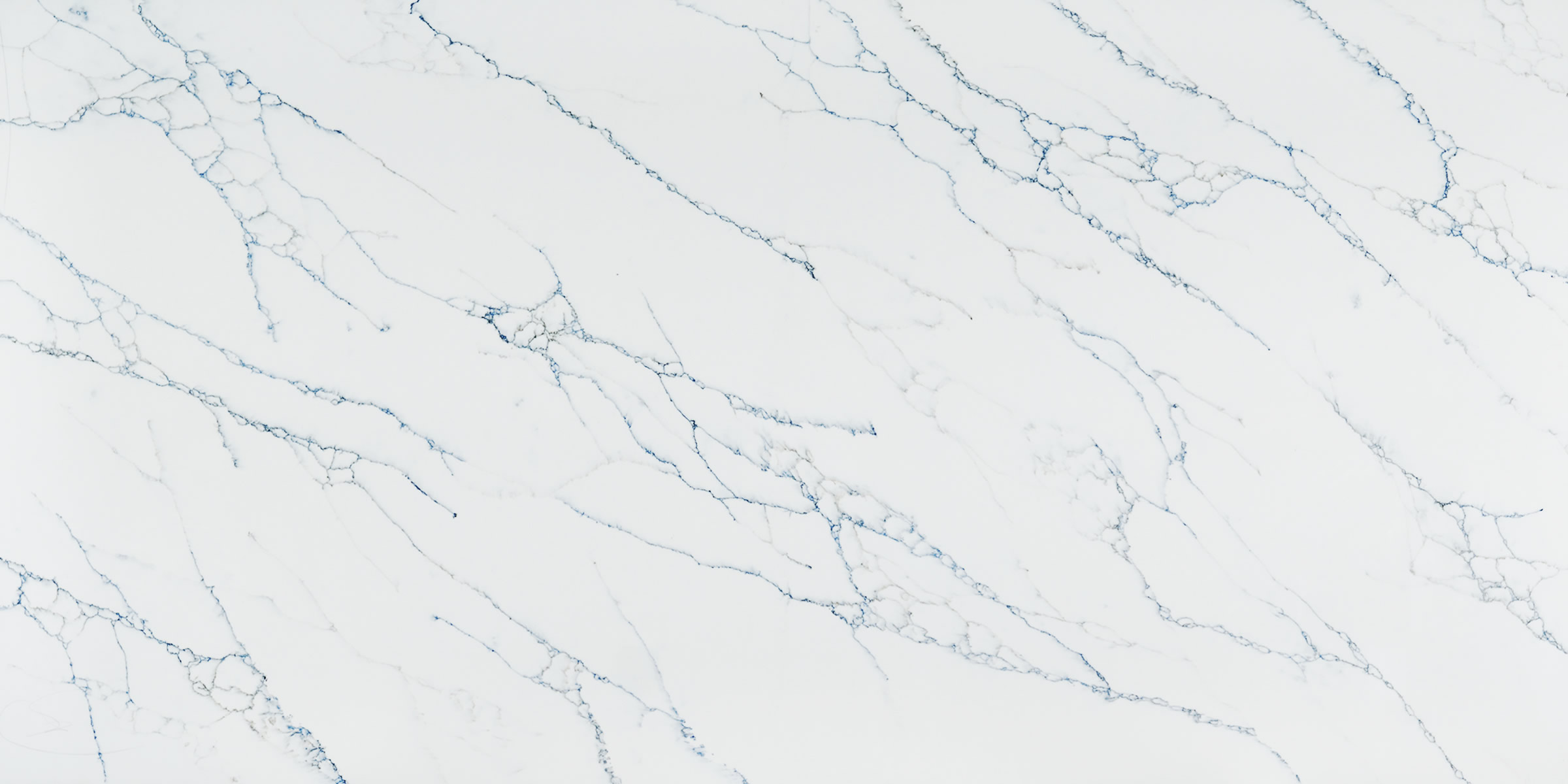 Calacatta Essence Jumbo Quartz by Venezia Surfaces with white background and thin gray-blue veins