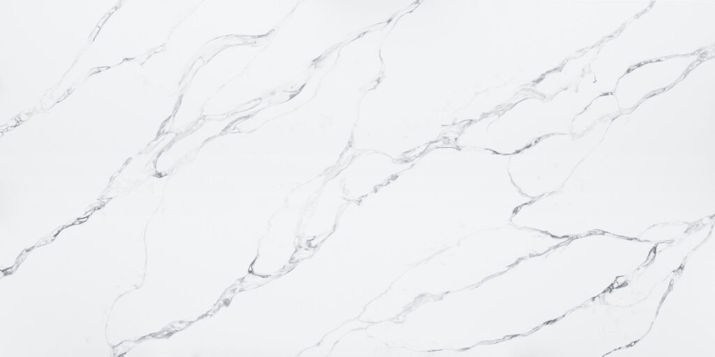 Calacatta Fantasy Jumbo Quartz by Venezia Surfaces with white background and soft gray veining