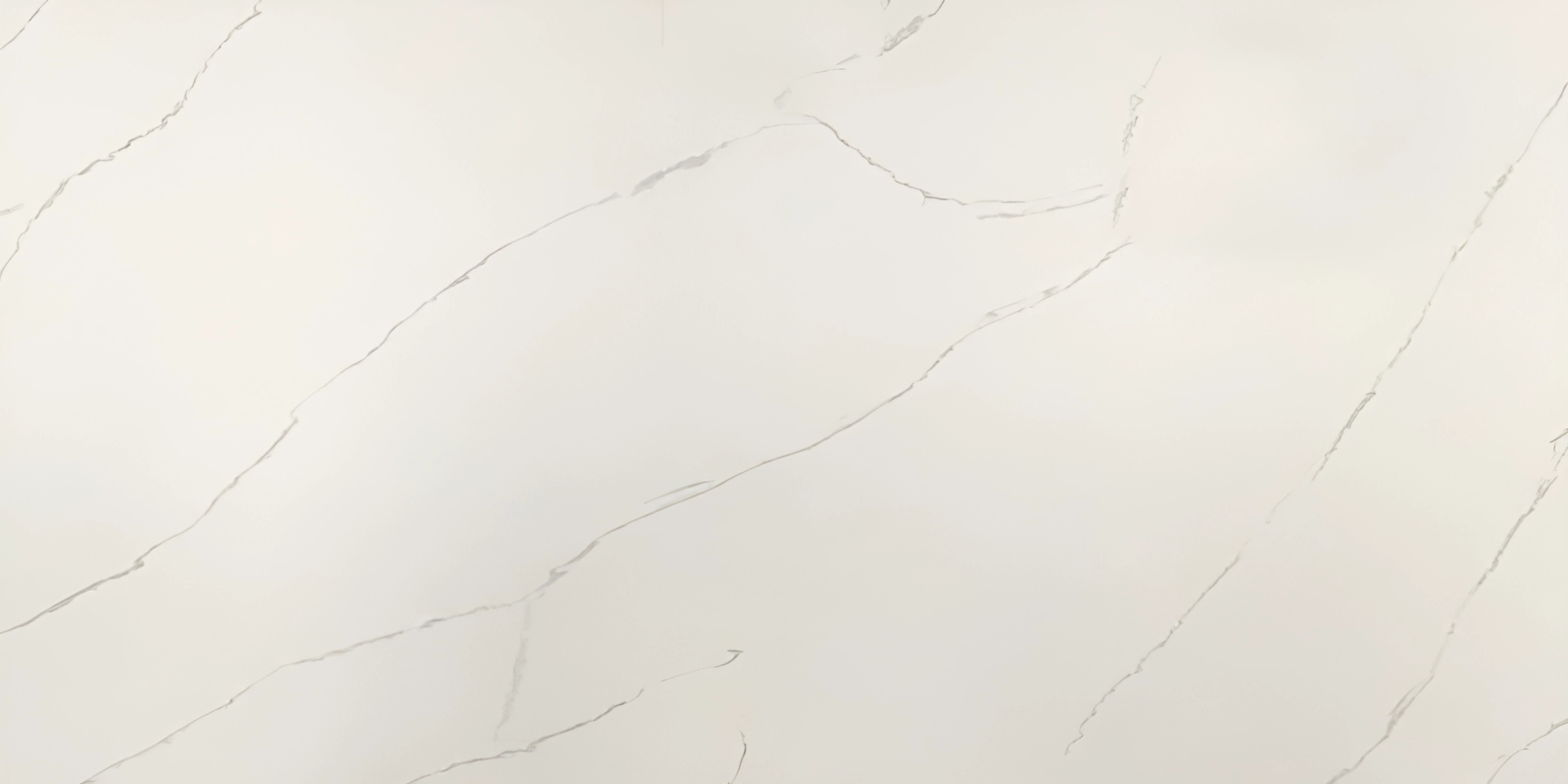 Calacatta Lincoln Jumbo Quartz by Venezia Surfaces with light cream background and subtle gray veining