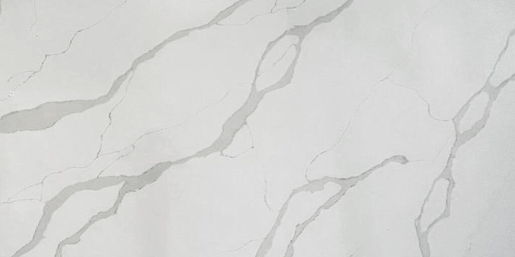 Calacatta Luxury Quartz by Venezia Surfaces with white background and soft gray veining