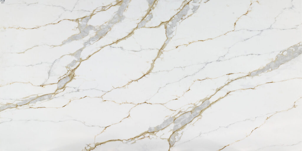 Calacatta Prime Quartz by Venezia Surfaces with white background gray veins and gold accents