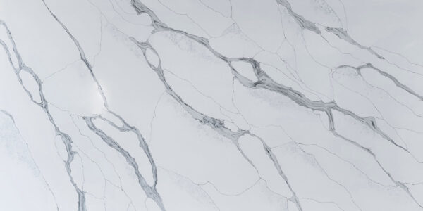 Calacatta Blue Jumbo Quartz by Venezia Surfaces with white background and blue gray veining
