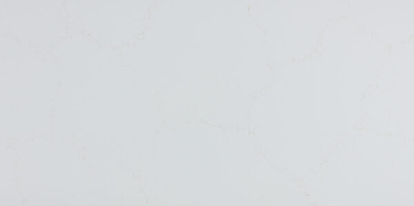 Calacatta Mysterio Gold IR Jumbo Quartz by Venezia Surfaces, a white quartz surface with soft warm gold veining.
