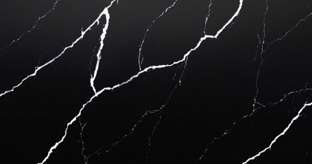 Calacatta Nero Marquino Jumbo Quartz by Venezia Surfaces with black background and thin white veining