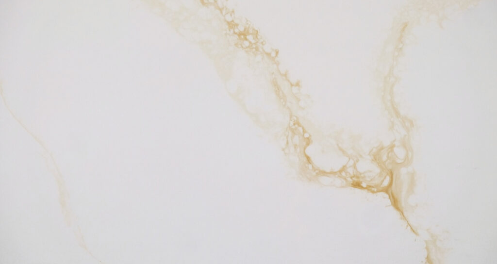 Calacatta Polaris Gold IR Quartz by Venezia Surfaces with white background and soft gold veining