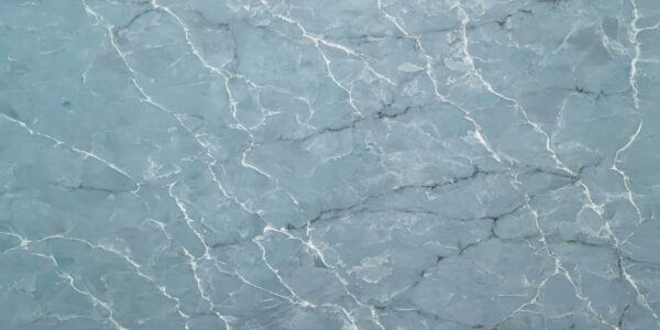Blue Onyx Quartz by Venezia Surfaces with soft blue tones and white veining