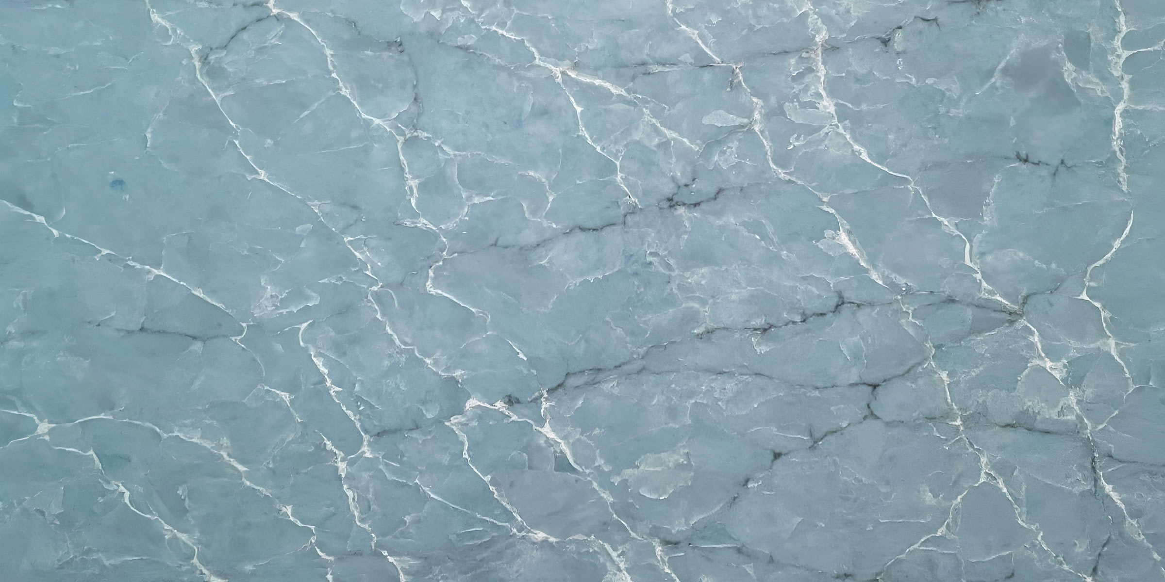 Blue Onyx Quartz by Venezia Surfaces with soft blue tones and white veining