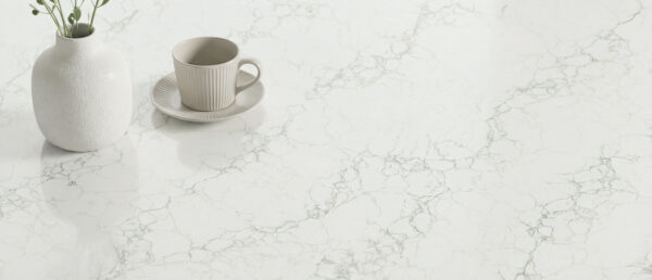 Close-up detail of Calacatta Jadira Quartz polished surface.