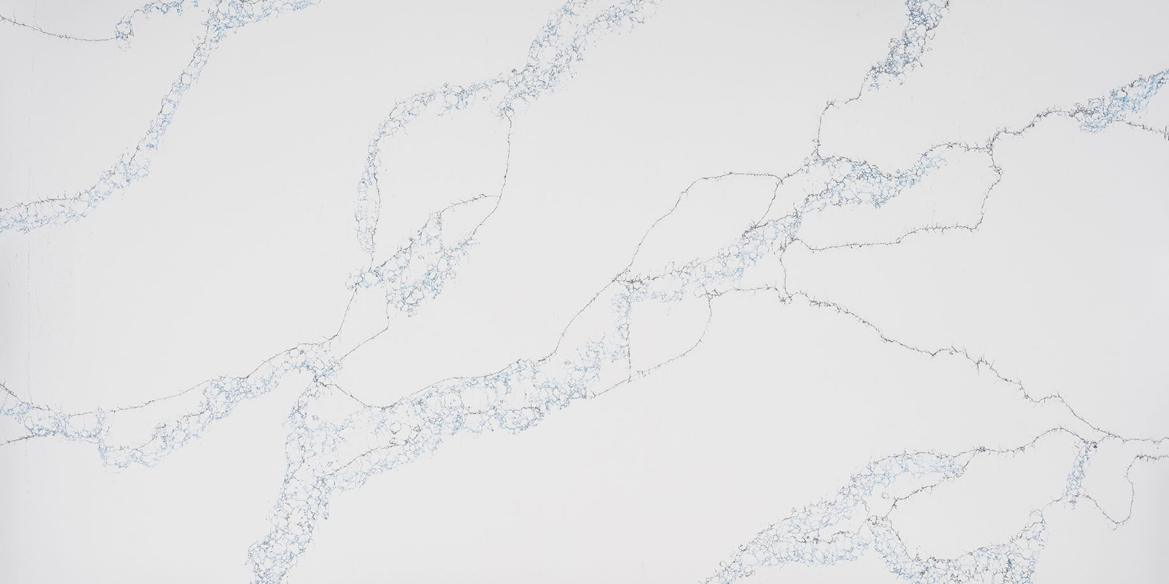 Calacatta Azure Black Fusion Jumbo Quartz by Venezia Surfaces with white background and blue gray veining