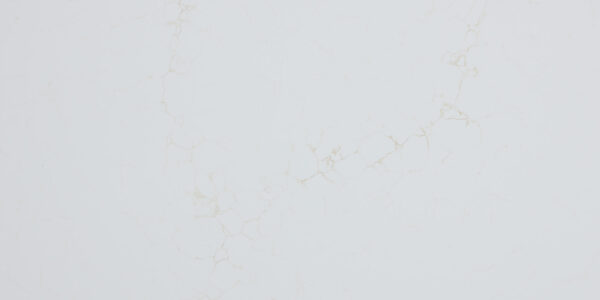 Calacatta Mysterio Gold IR Jumbo Quartz by Venezia Surfaces, a white quartz surface with soft warm gold veining.