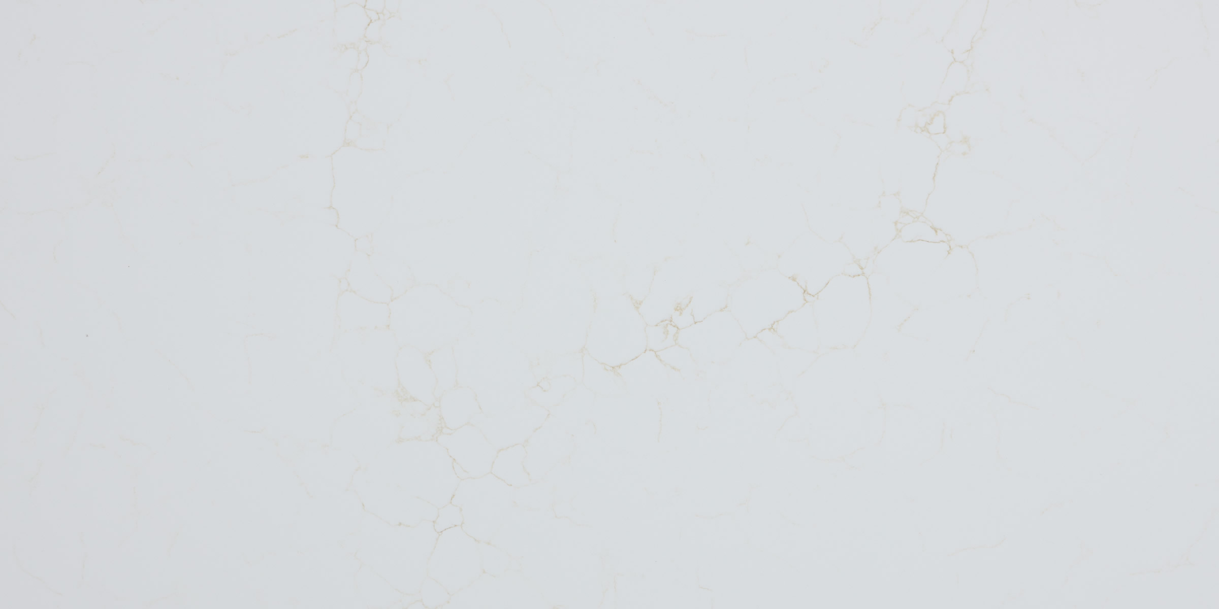 Calacatta Mysterio Gold IR Jumbo Quartz by Venezia Surfaces, a white quartz surface with soft warm gold veining.
