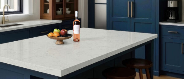 Calacatta Aidana Quartz full slab showing a bright white base with ultra-realistic silver and gray veining.