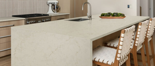 Modern kitchen island with waterfall featuring MarfiTaj Quartz countertops.