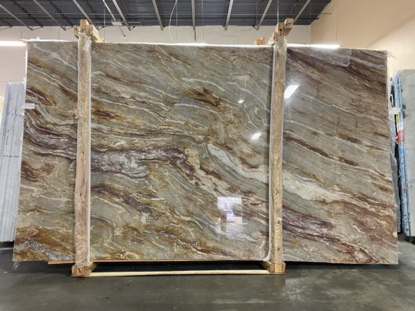 Nacarado quartzite slabs with beige and brown movement displayed on racks