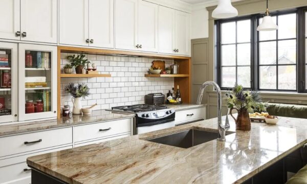 Nacarado quartzite countertops and island in a kitchen with white cabinets