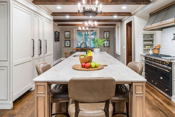 Allure quartzite island in a kitchen with white cabinets