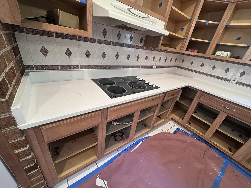 Carrara Delphi cooktop kitchen countertops after installation