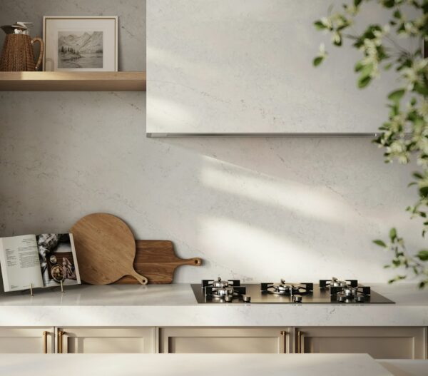 Lightborne Silestone kitchen countertop and backsplash beside a cooktop