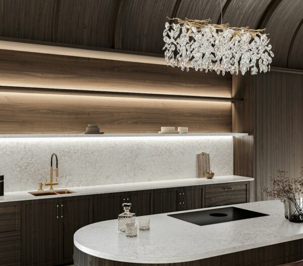 Riviére Rose Silestone kitchen island and illuminated backsplash with dark wood cabinetry
