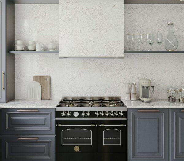 Riviére Rose Silestone backsplash and hood surround above a range cooker