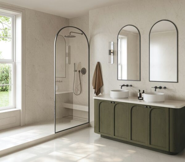 Soft Sand Silestone surfaces in a bathroom with a glass shower enclosure
