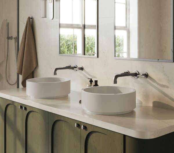 Soft Sand Silestone vanity countertop beneath two round vessel sinks